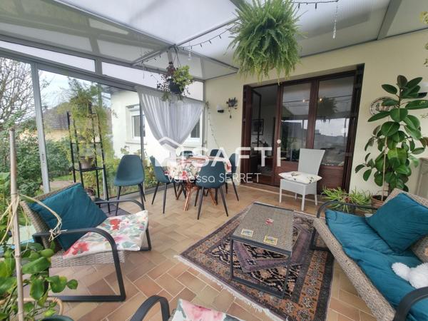 Maison familiale avec véranda plein sud et jardin arboré : un havre de paix à Saint-Hilaire-Petitville.