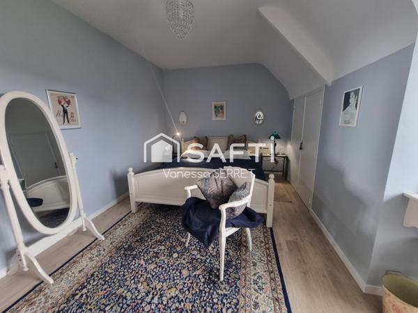 Maison familiale avec véranda plein sud et jardin arboré : un havre de paix à Saint-Hilaire-Petitville.