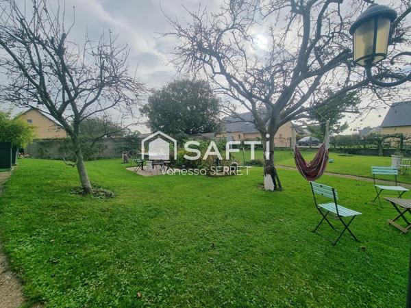 Maison familiale avec véranda plein sud et jardin arboré : un havre de paix à Saint-Hilaire-Petitville.