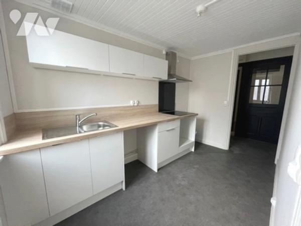 Immeuble de Rapport à usage commercial et habitation à vendre à 15 Km de Lille Ouest (Armentières).