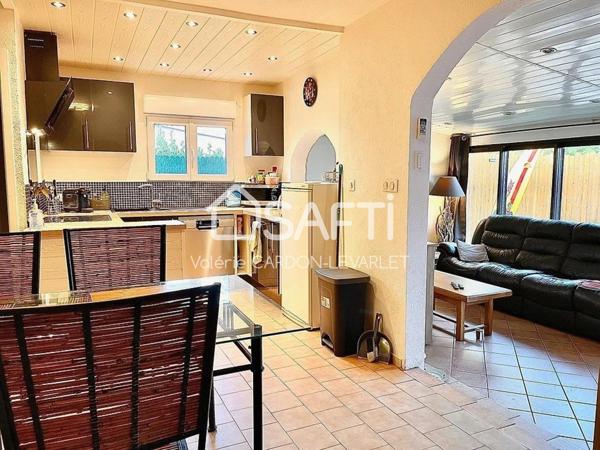 Maison de plain-pied de 67 m2 avec 3 chambres et jardin clos.