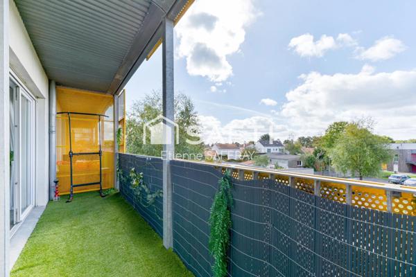 Appartement lumineux avec balcon et 2 places de parking