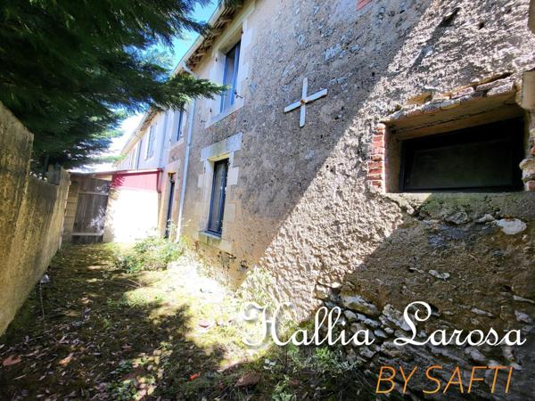 Ensemble immobilier avec garage et jardin