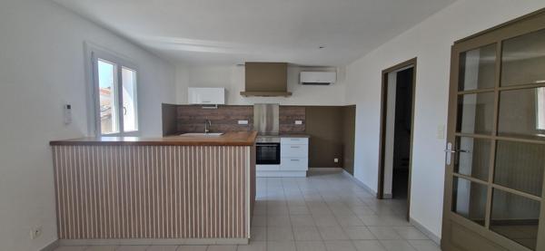 BEL APPARTEMENT AVEC GRAND GARAGE