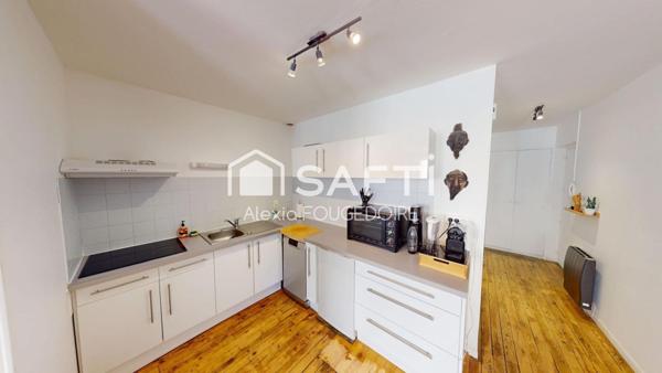 APPARTEMENT ATYPIQUE POUTRE ET PIERRE APPARENTE TYPE 2