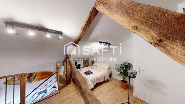 APPARTEMENT ATYPIQUE POUTRE ET PIERRE APPARENTE TYPE 2