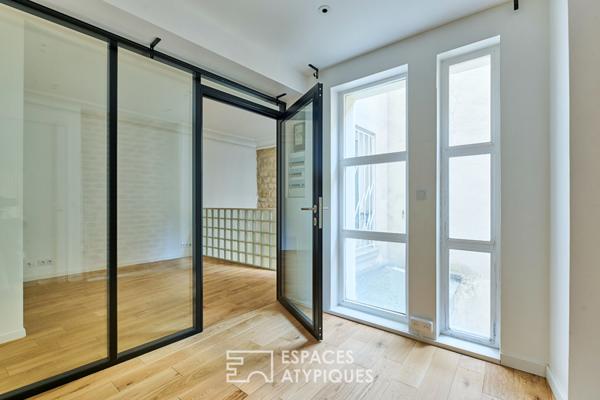 Ancien studio photo transformé en triplex à Marcadet – Poissonniers