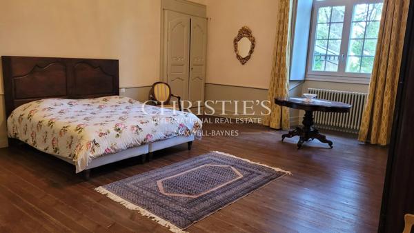 An elegant historic château in an elevated location with sweeping views of the Gers countryside