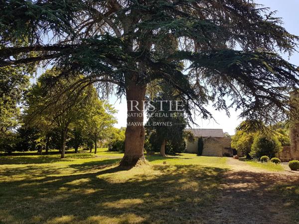 An elegant historic château in an elevated location with sweeping views of the Gers countryside