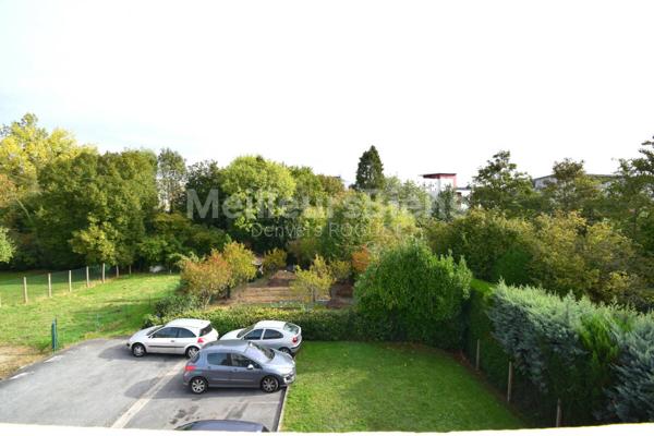 Appartement 2 chambres avec balcon, cave et garage