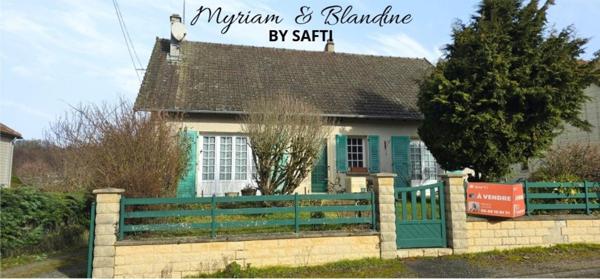 Maison semi enterrée, 4 chambres, double garage, jardin