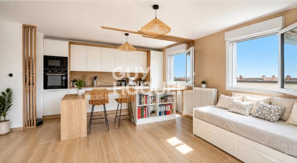Appartement à vendre de 2 pièces de 51 m² avec place de parking couverte - Ascenseur