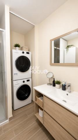 Appartement à vendre de 2 pièces de 51 m² avec place de parking couverte - Ascenseur