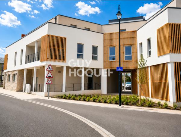 Appartement à vendre de 2 pièces de 51 m² avec place de parking couverte - Ascenseur