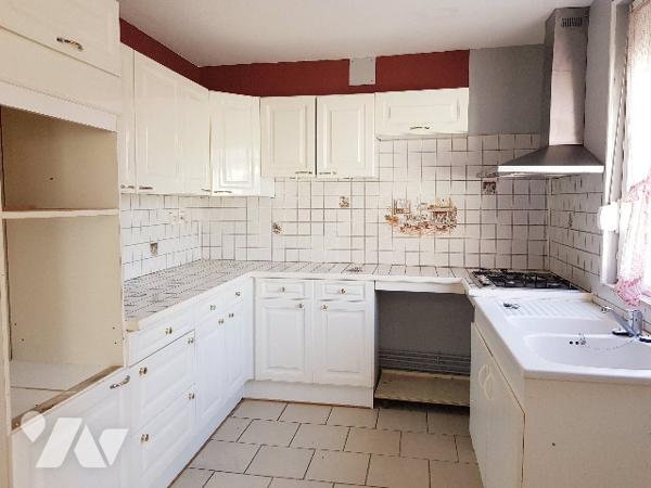 Plain pied de 76 m² habitable proche du centre ville avec garage.