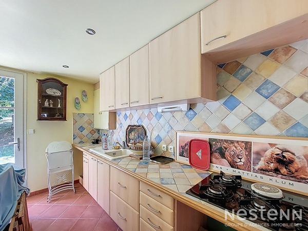 A Vendre Maison des années 1960 de 133 m² sur sous-sol avec jardin et garage de 64 m²