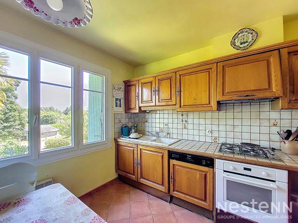 A Vendre Maison des années 1960 de 133 m² sur sous-sol avec jardin et garage de 64 m²