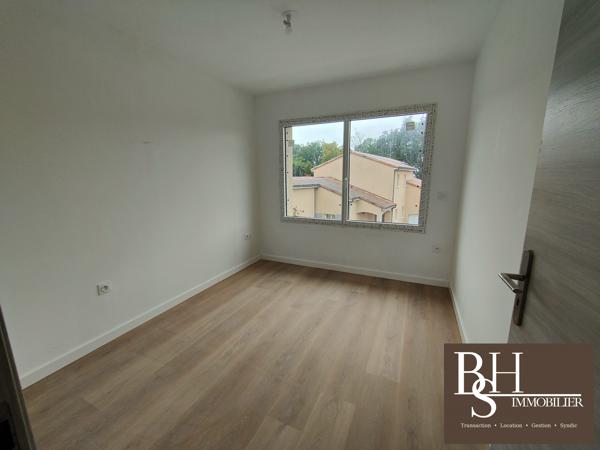 NEUF - Appartement 3 pièces d'environ 59m² avec balcon et parking dans résidence sécurisée