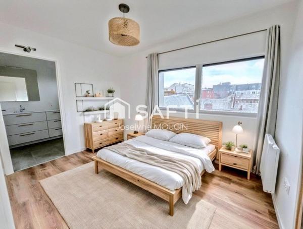 Centre ville d'Amiens, appartement 3 chambres, terrasse, 2 places de stationnement en sous-sol.