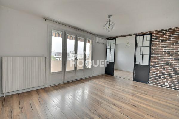 Appartement T4 de 73 m² avec balcon, parking et cave à Villeurbanne (69100).