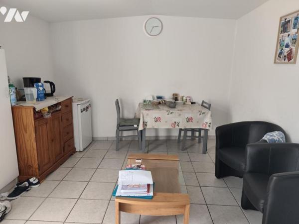 Ensemble immobilier composé de trois logements, garage et local technique