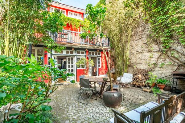 Maison avec cour pavée et jardin à l’esprit japonisant