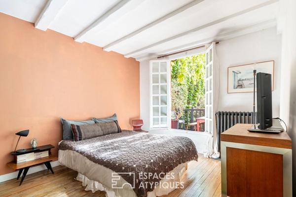 Maison avec cour pavée et jardin à l’esprit japonisant