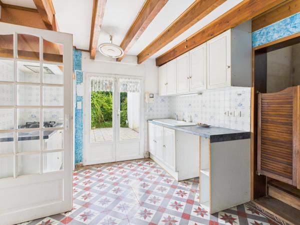 Grande maison familiale avec jardin clos et fort potentiel