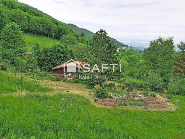 Chalet en bois avec vue panoramique sur les Alpes