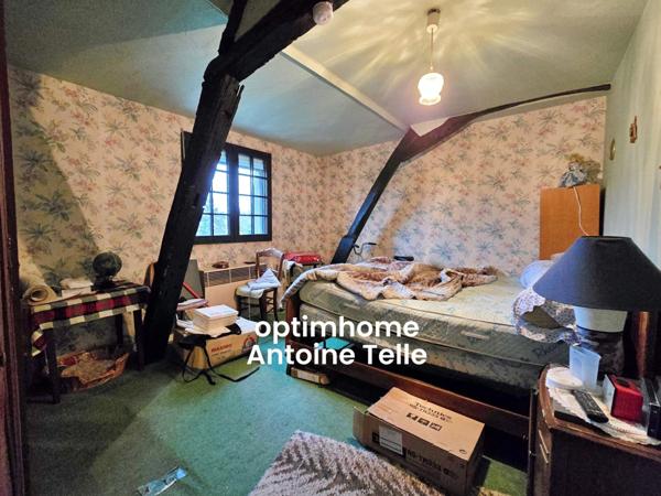 Le Cateau - Maison semi-individuelle à double accès avec garage, devanture & jardin clos.