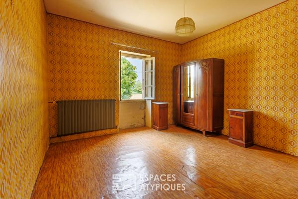 Corps de ferme dans écrin de nature à rénover