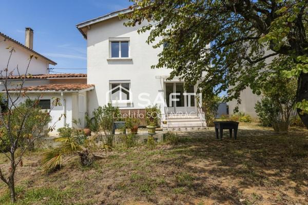 A proximité du centre, charmante maison avec garage et jardin.