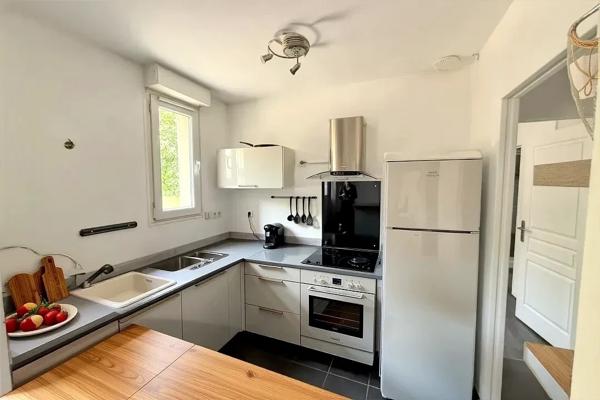 Appartement F2 en rez-de-chaussée avec cave et place de parking