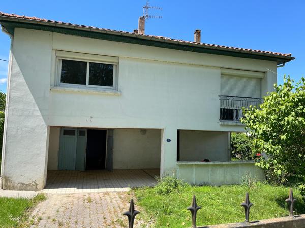 Maison sur sous sol avec jardin