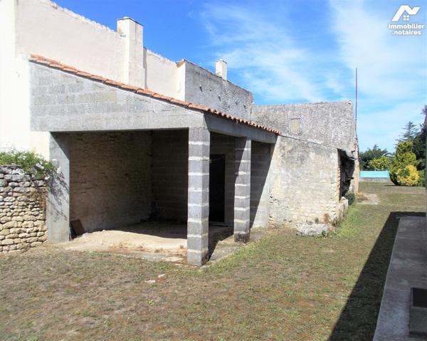 En centre-ville, au calme, jolie maison de plain-pied avec jardin sur 304 m2