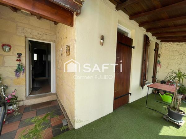 Maison en pierre mitoyenne : 2 chambres, jardin, garage et un potentiel studio !