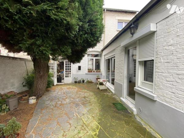 Maison de ville 4 chambres jardin et garage.