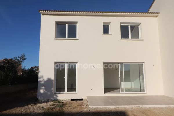 Maison individuelle avec 3 chambres, garage, terrasse et jardin