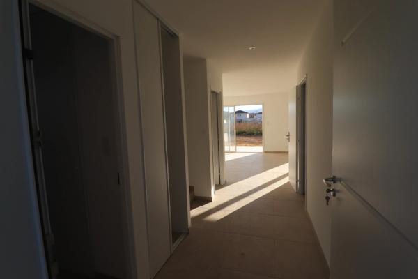 Maison individuelle avec 3 chambres, garage, terrasse et jardin