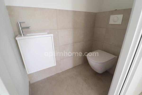 Maison individuelle avec 3 chambres, garage, terrasse et jardin