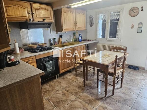 Maison mitoyenne 4 pièces,2 chambres,garage,jardin