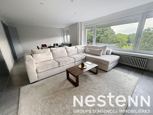 Appartement - 2 chambres - lumineux - balcon - stationnement - garage - cave - grenier