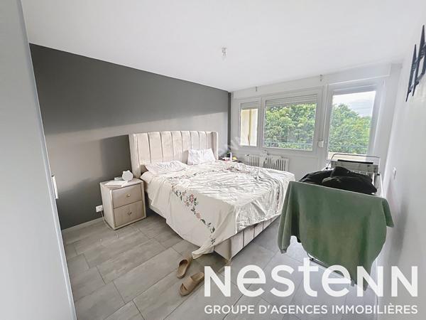 Appartement - 2 chambres - lumineux - balcon - stationnement - garage - cave - grenier