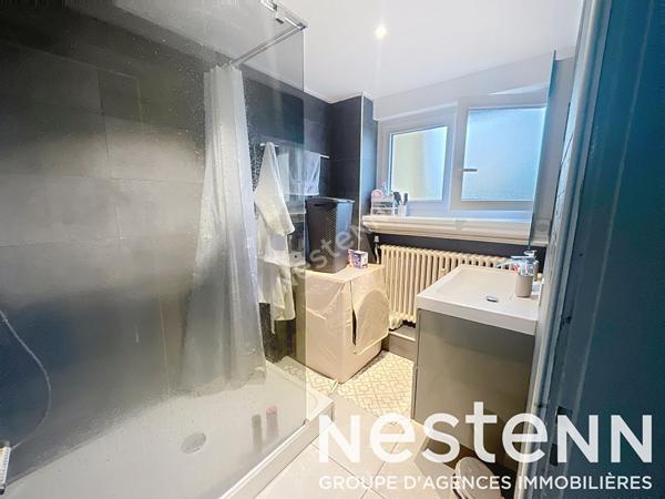 Appartement - 2 chambres - lumineux - balcon - stationnement - garage - cave - grenier