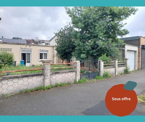 maison à fort potentiel avec grand garage et jardin