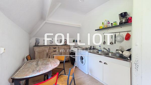 A vendre Saint Jean le Thomas Immeuble avec local commercial, deux appartements, jardin et garage