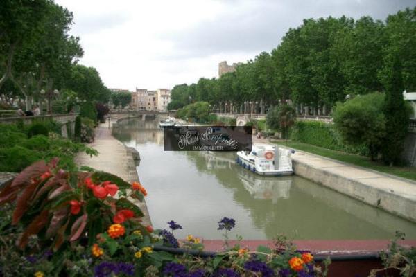 MURS COMMERCIAUX 70 m2 LOUÉS, RAPPORT 9 % NET.
