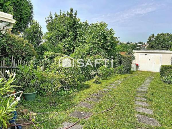 Maison avec jardin, terrasse et grand garage