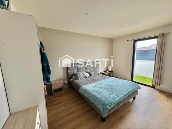 PLAIN PIED 4 CHAMBRES DONT UNE SUITE PARENTALE, GARAGE ET JARDIN A VOUILLE