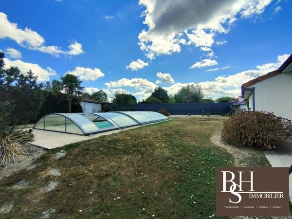 Maison 5 pièces de 187m² sur parcelle de 2065m² avec piscine, garages et boulodrome